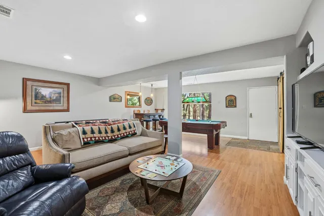 a view of house with deck and outdoor seating