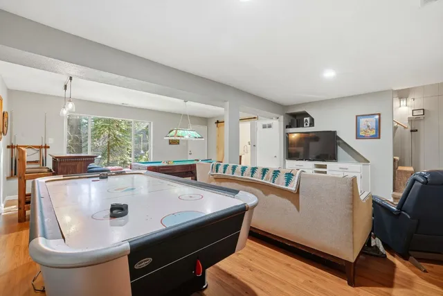 a view of a house with a yard and sitting area