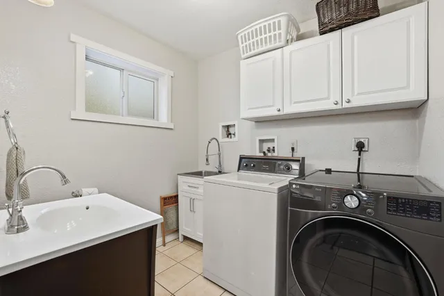 a backyard of a house with yard fire pit table and chairs