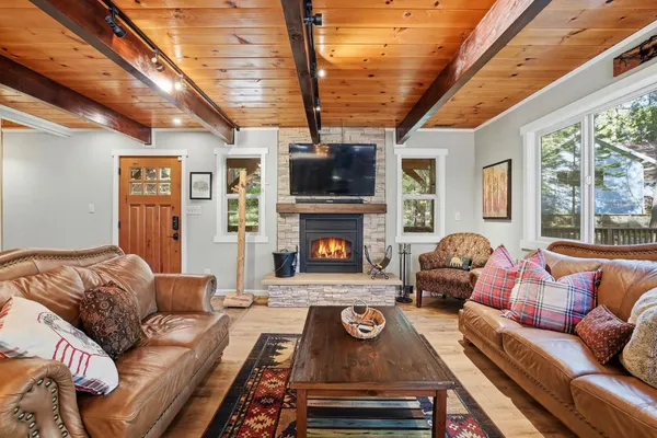 a open kitchen with stainless steel appliances granite countertop a stove a sink and a refrigerator