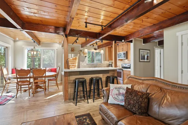 a kitchen with stainless steel appliances granite countertop a sink and a window
