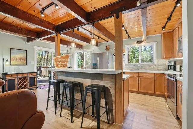 a kitchen with a sink stove and microwave