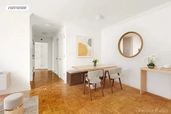 a view of a room that has a table and chair in it