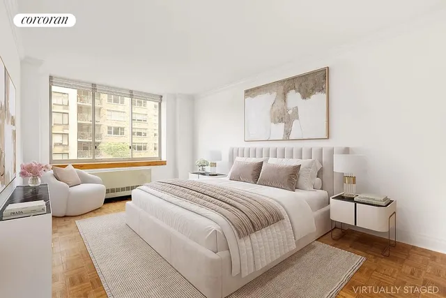 a bedroom with bed and a large window