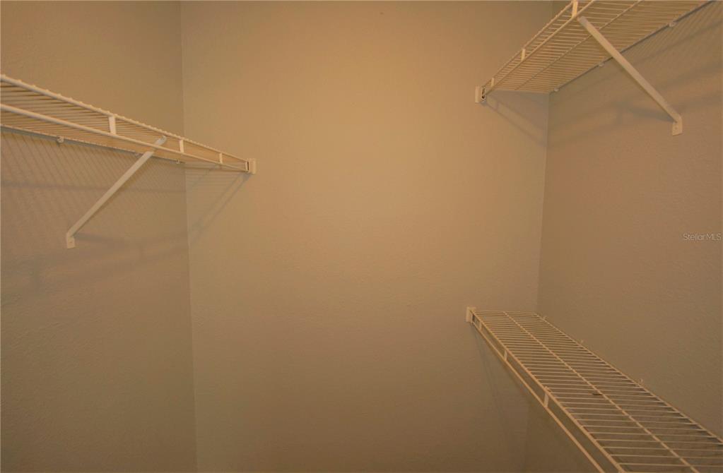 4572 Commander Drive, Unit 1237 Orlando, FL 32822 - Photo 15 of 31 a view of a room with racks on the wall