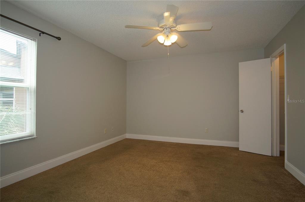 4572 Commander Drive, Unit 1237 Orlando, FL 32822 - Photo 17 of 31 an empty room with a window