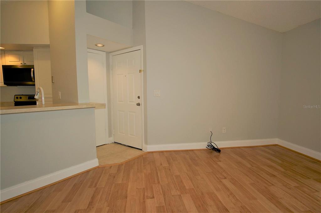 4572 Commander Drive, Unit 1237 Orlando, FL 32822 - Photo 18 of 31 a view of a room with wooden floor and a window