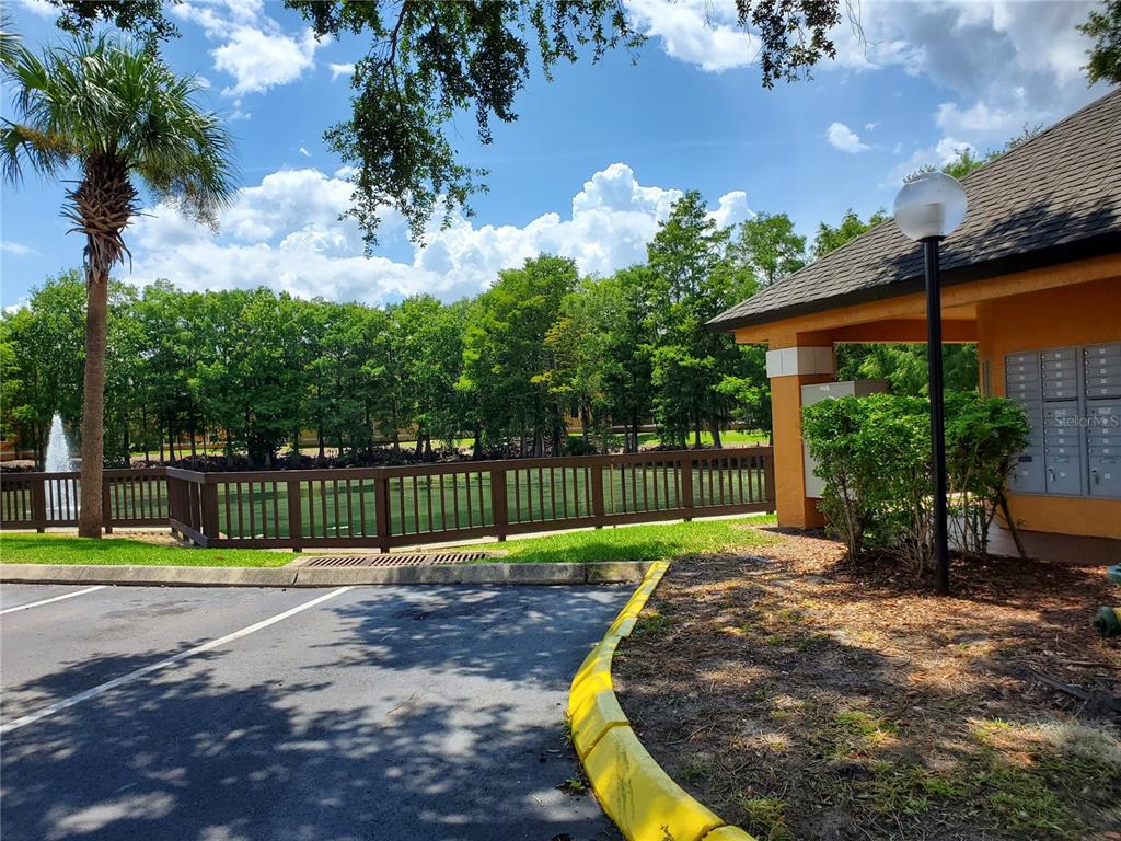 4572 Commander Drive, Unit 1237 Orlando, FL 32822 - Photo 22 of 31 a view of a backyard with palm tree
