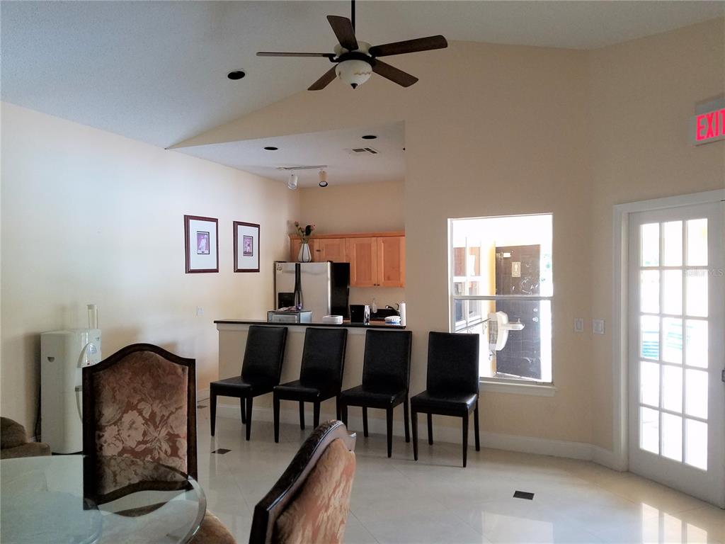 4572 Commander Drive, Unit 1237 Orlando, FL 32822 - Photo 23 of 31 a view of a dining room with furniture and window