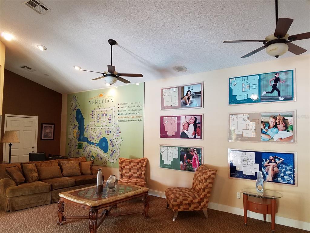 4572 Commander Drive, Unit 1237 Orlando, FL 32822 - Photo 26 of 31 a living room with furniture and a chandelier
