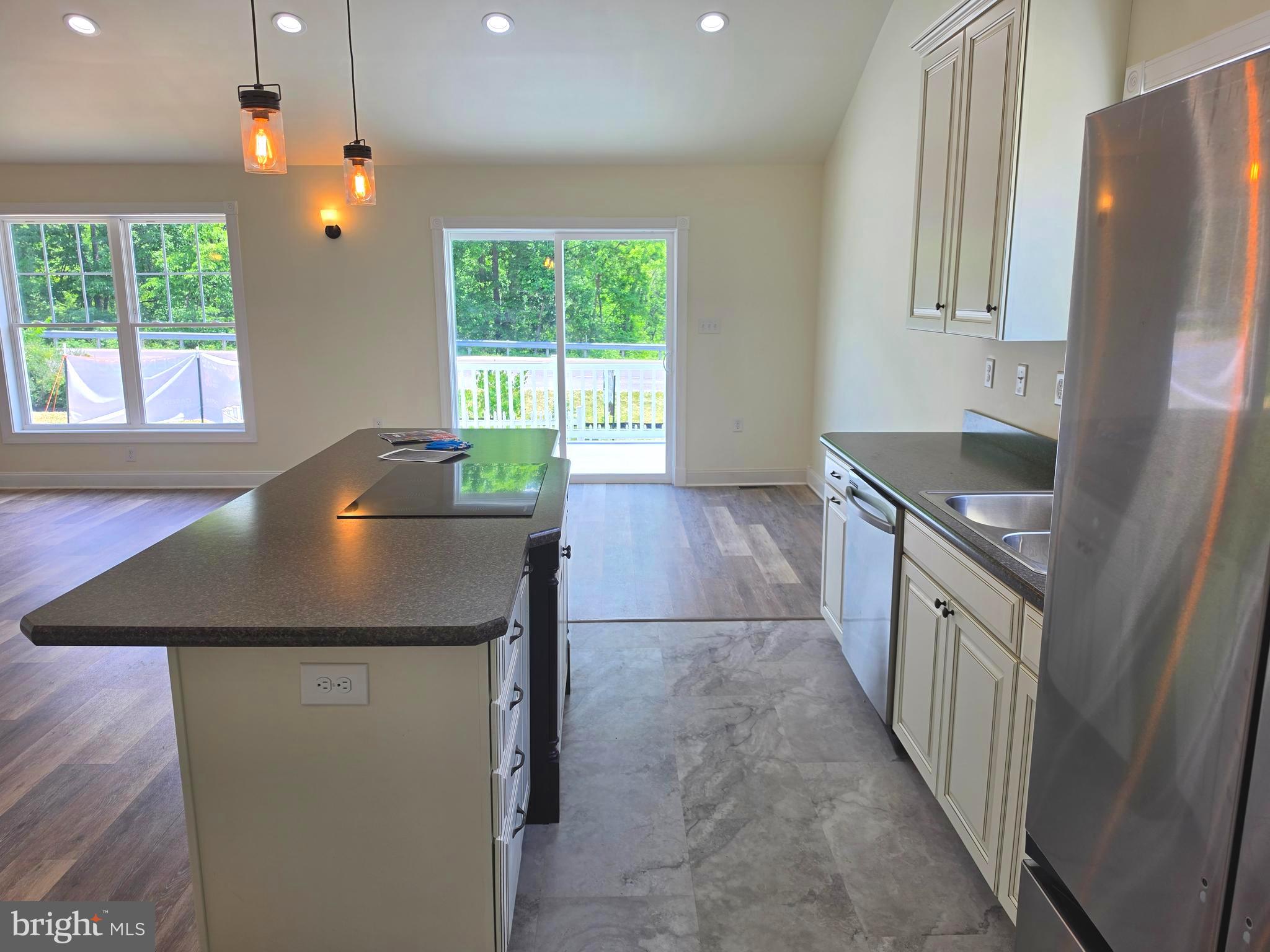 13514 Old Cresaptown Road Southwest Lavale, MD 21502 - Photo 10 of 25 a kitchen with stainless steel appliances granite countertop a sink a stove a refrigerator and a window