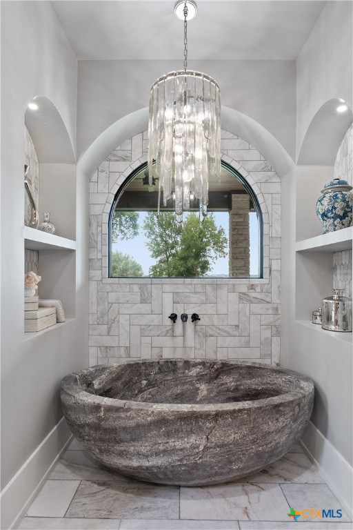 19102 Post Oak Road Bartlett, TX 76511 - Photo 21 of 43 a room with a chandelier