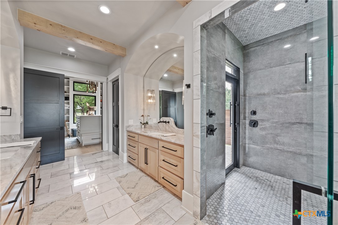19102 Post Oak Road Bartlett, TX 76511 - Photo 22 of 43 a bathroom with a double vanity sink toilet and shower