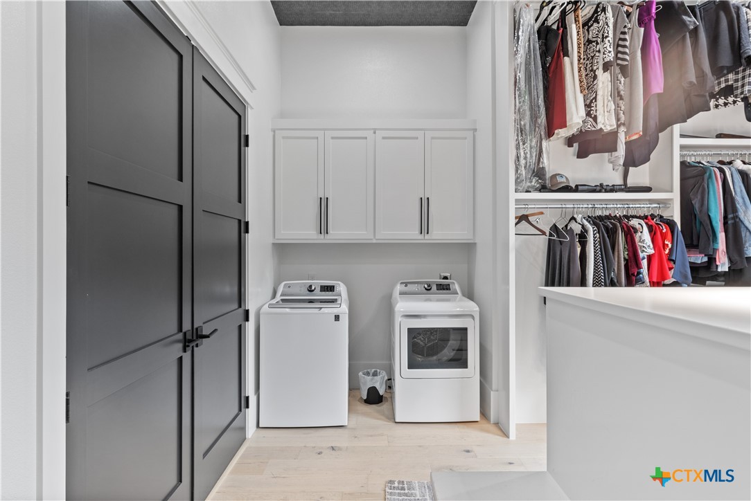 19102 Post Oak Road Bartlett, TX 76511 - Photo 26 of 43 a view of walk in closet with clothes and shoes
