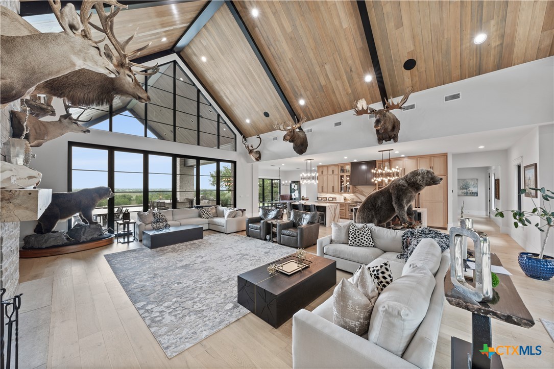 19102 Post Oak Road Bartlett, TX 76511 - Photo 27 of 43 a living room with furniture and a floor to ceiling window