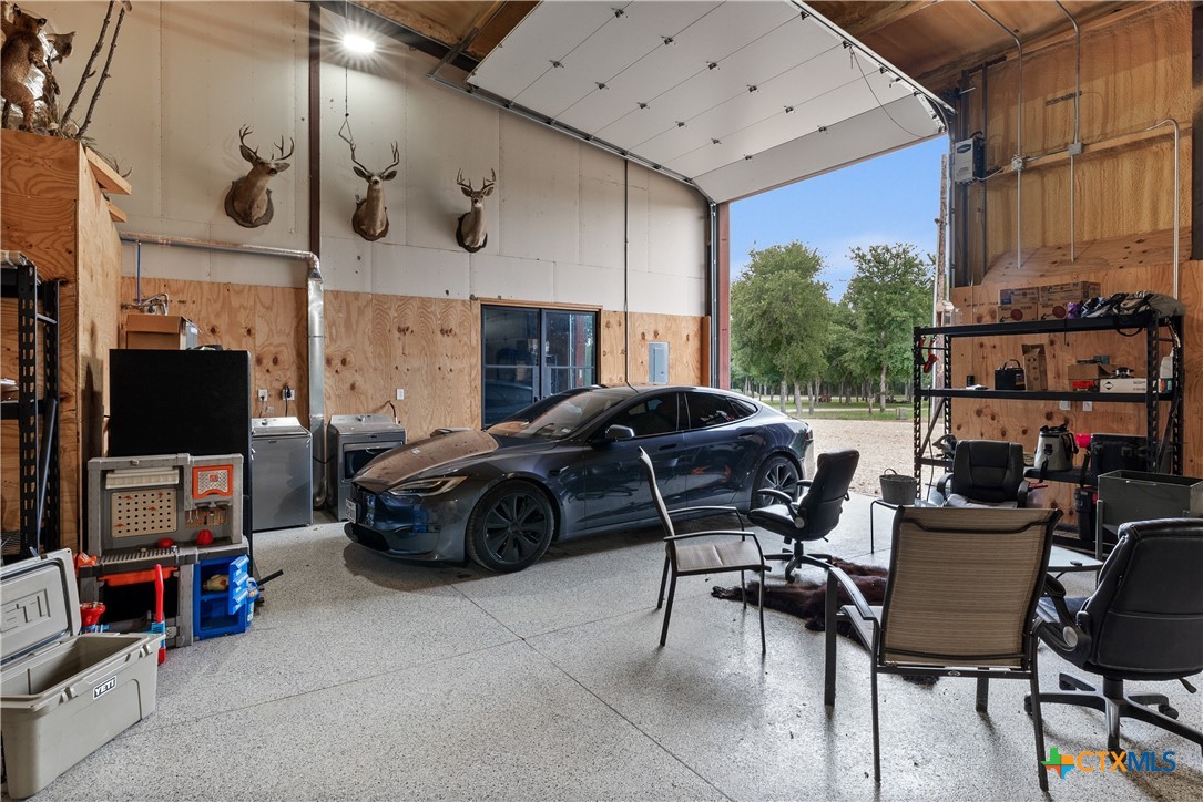 19102 Post Oak Road Bartlett, TX 76511 - Photo 29 of 43 a car parked in a garage
