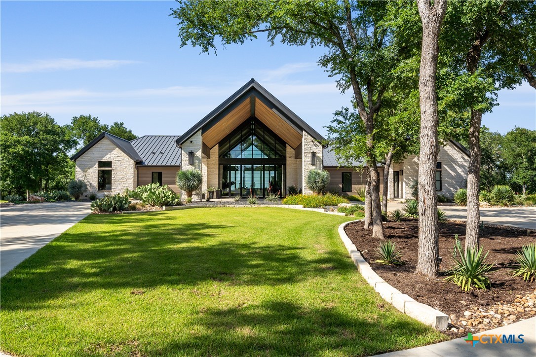 19102 Post Oak Road Bartlett, TX 76511 - Photo 3 of 43 a front view of a house with garden