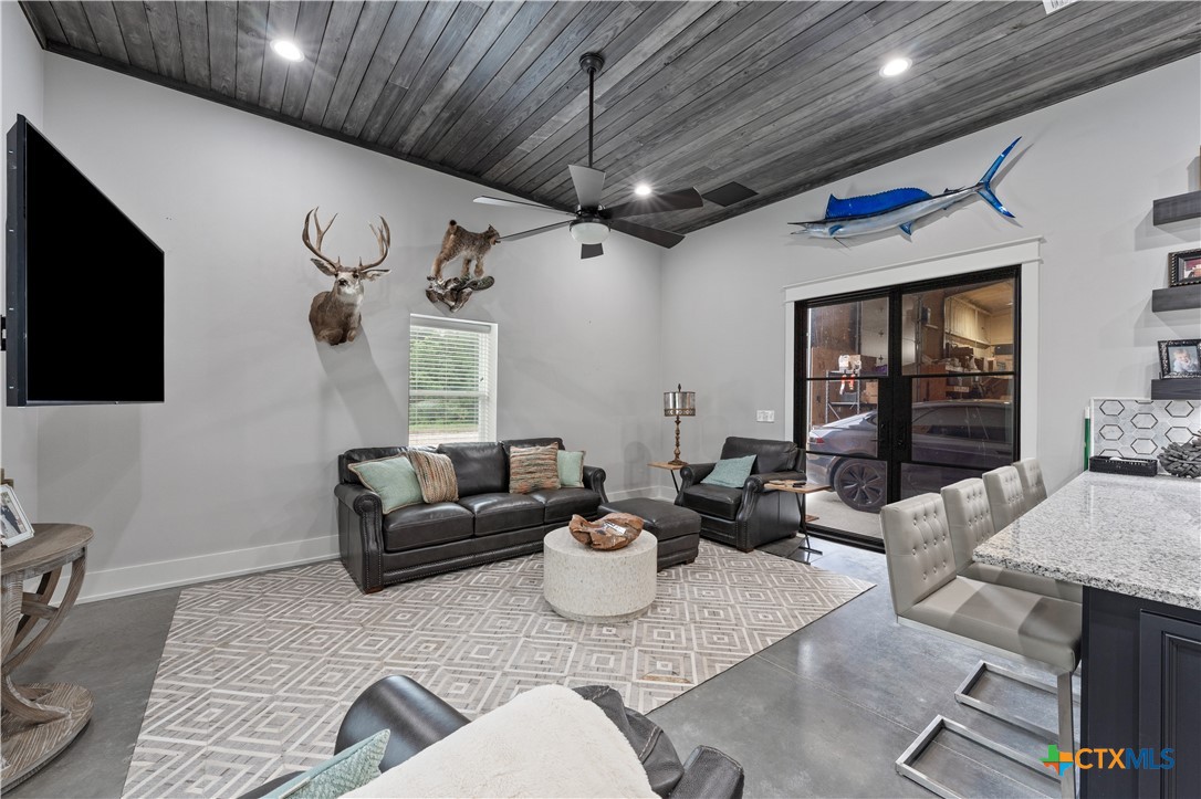 19102 Post Oak Road Bartlett, TX 76511 - Photo 31 of 43 a living room with furniture and a flat screen tv