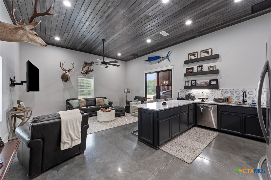 19102 Post Oak Road Bartlett, TX 76511 - Photo 33 of 43 a large room with stainless steel appliances kitchen island granite countertop lots of counter top space