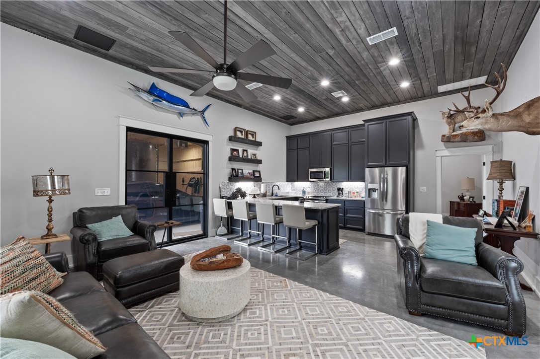 19102 Post Oak Road Bartlett, TX 76511 - Photo 34 of 43 a living room with furniture and a chandelier