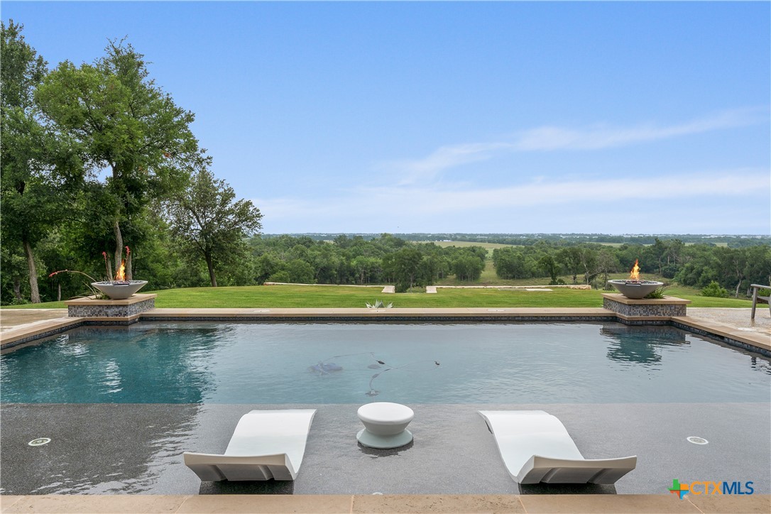 19102 Post Oak Road Bartlett, TX 76511 - Photo 41 of 43 a view of a lake with couches chairs and a table
