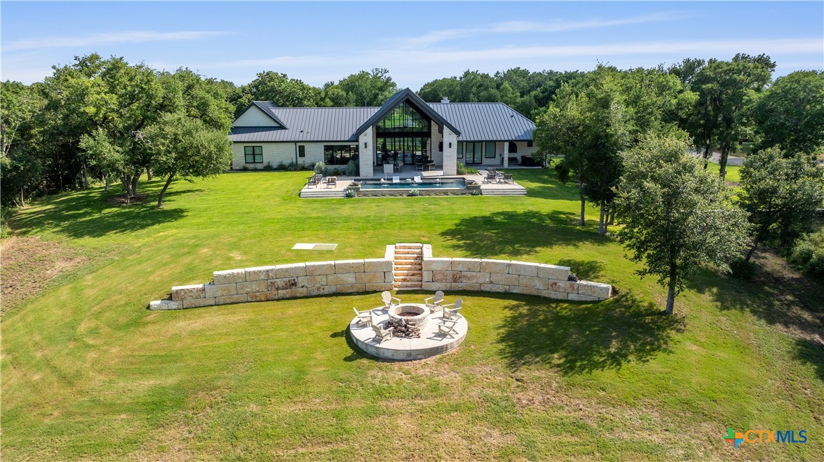 19102 Post Oak Road Bartlett, TX 76511 - Photo 6 of 43 a view of a house with swimming pool and a yard