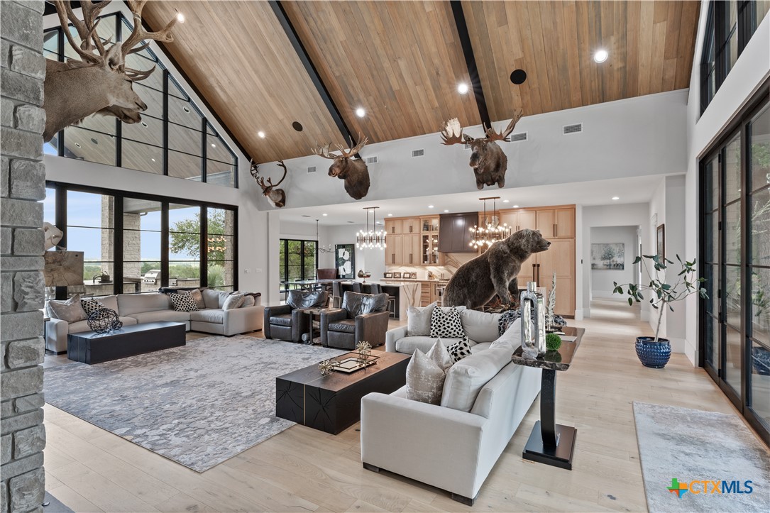 19102 Post Oak Road Bartlett, TX 76511 - Photo 8 of 43 a living room with furniture and a chandelier