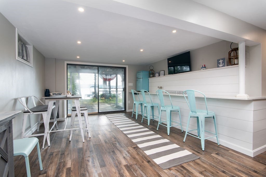 233 Hooppole Road Mashpee, MA 02649 - Photo 16 of 41 a living room with furniture and wooden floor