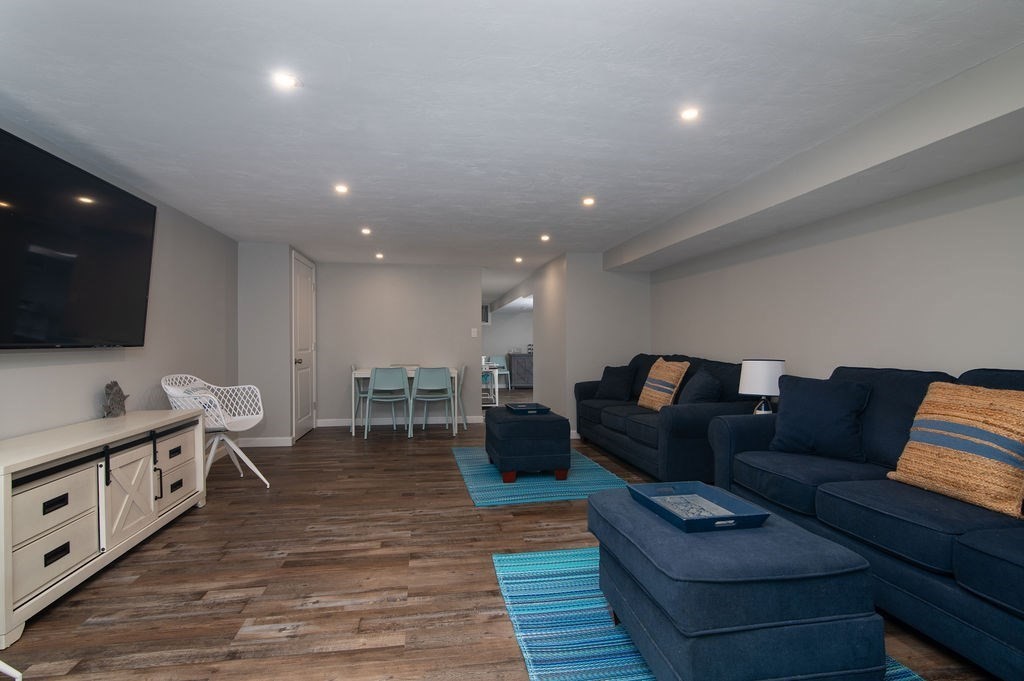 233 Hooppole Road Mashpee, MA 02649 - Photo 19 of 41 a living room with furniture and a flat screen tv