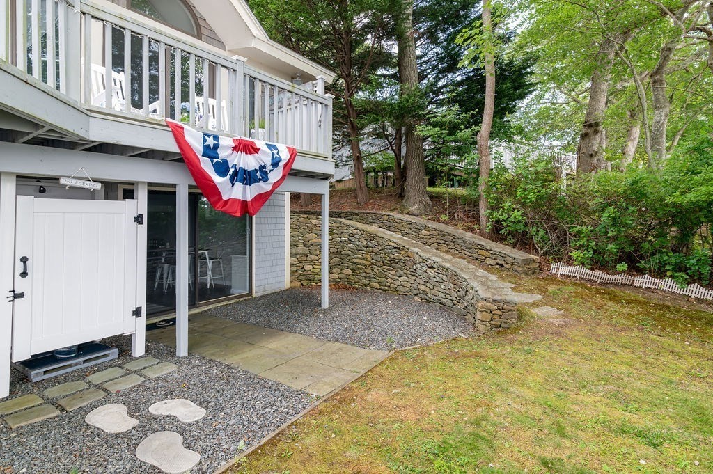 233 Hooppole Road Mashpee, MA 02649 - Photo 28 of 41 a view of a chairs on the deck