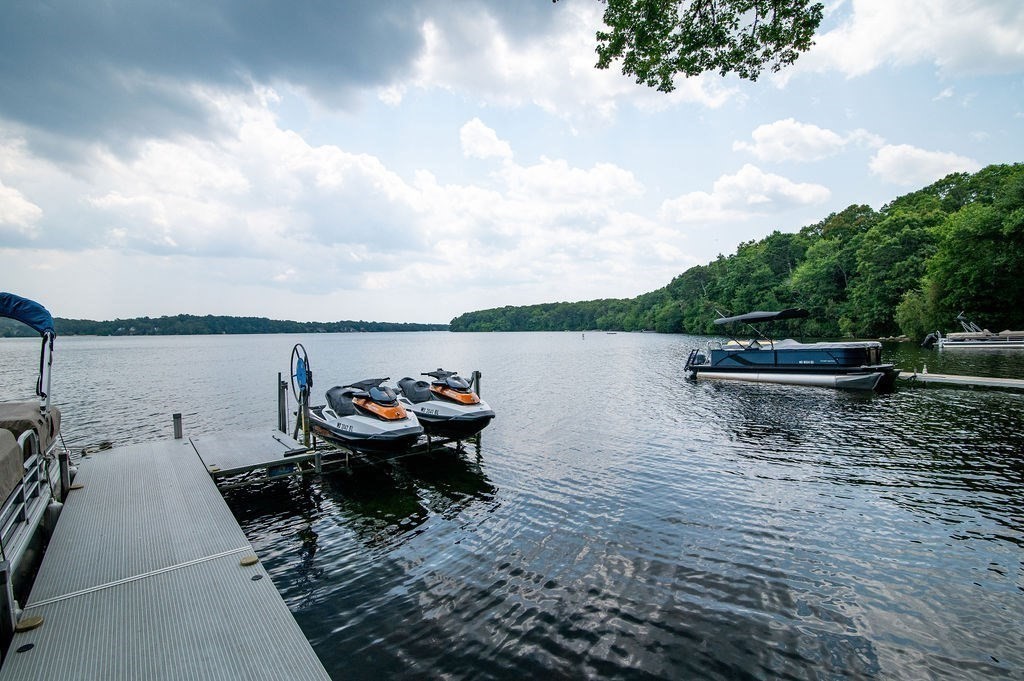 233 Hooppole Road Mashpee, MA 02649 - Photo 33 of 41 a lake view with a bench and lake view