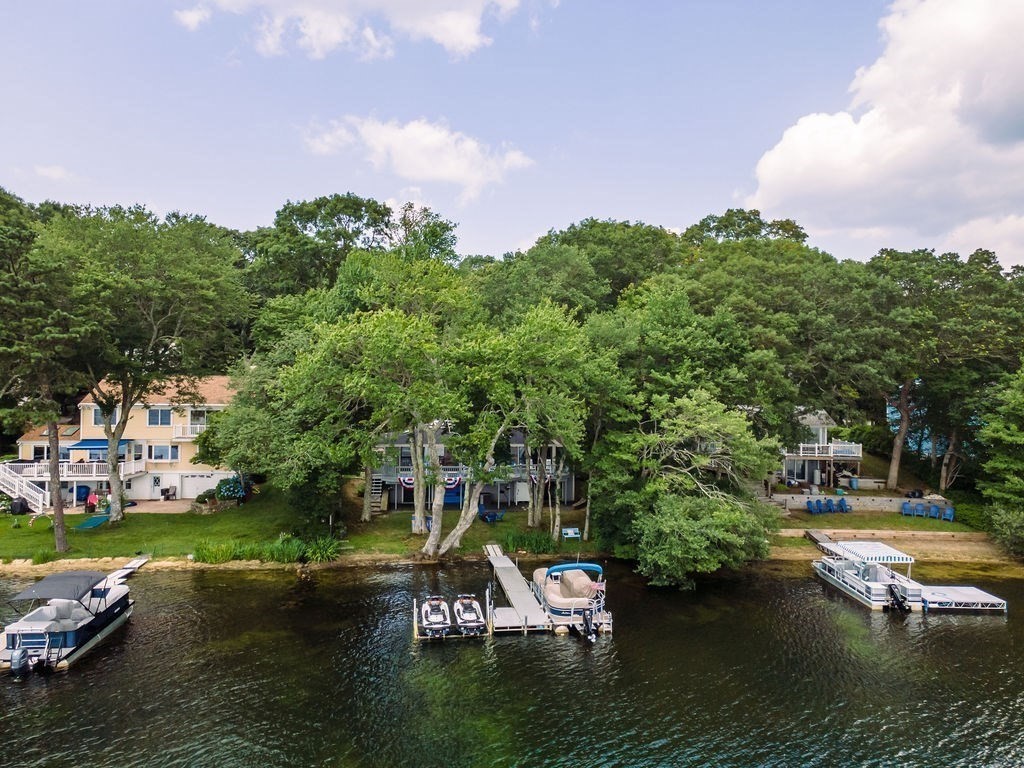 233 Hooppole Road Mashpee, MA 02649 - Photo 35 of 41 a view of a lake with houses