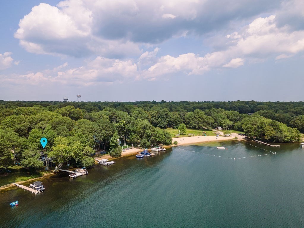 233 Hooppole Road Mashpee, MA 02649 - Photo 36 of 41 a view of a lake with houses in back