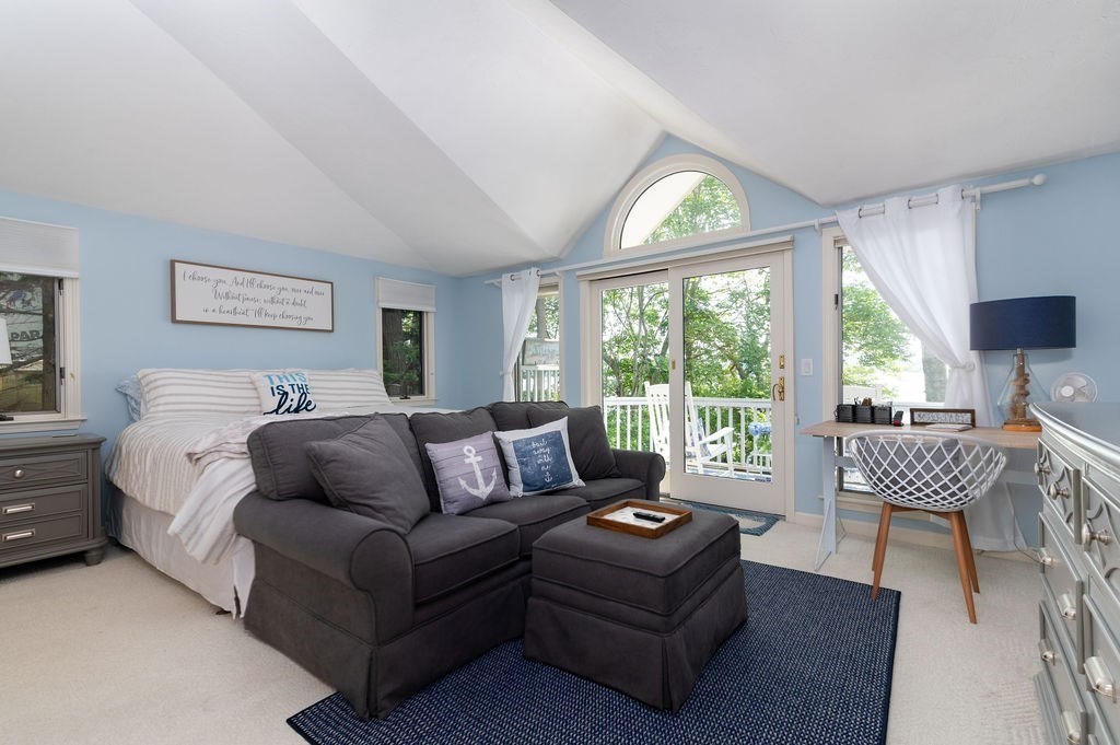 233 Hooppole Road Mashpee, MA 02649 - Photo 9 of 41 a living room with furniture and a large window