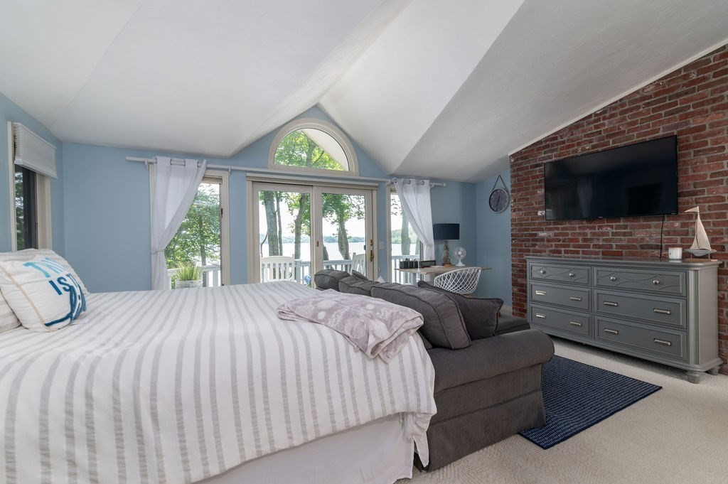 233 Hooppole Road Mashpee, MA 02649 - Photo 10 of 41 a bedroom with a bed and a flat screen tv