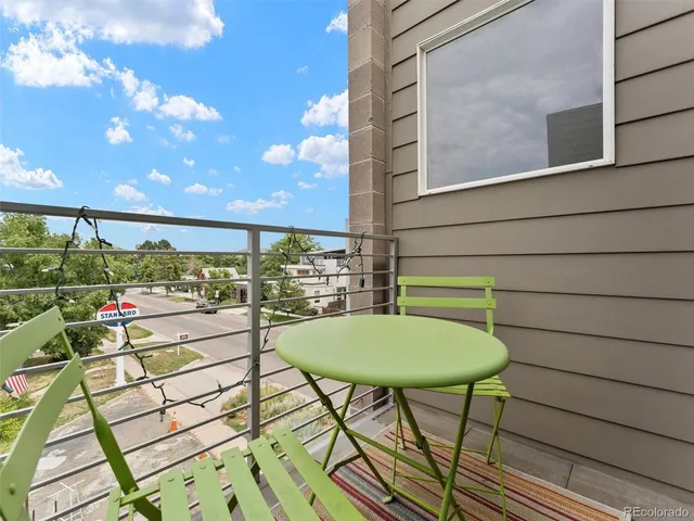 a bedroom with a bed and a lamp