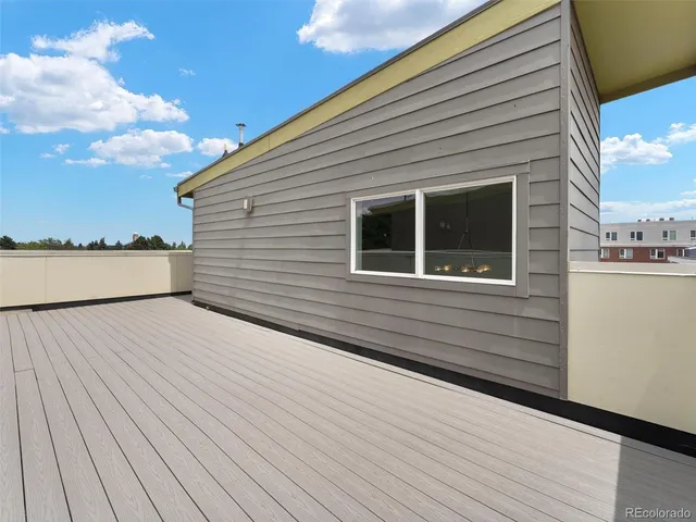 a view of an entryway with wooden floor and a window