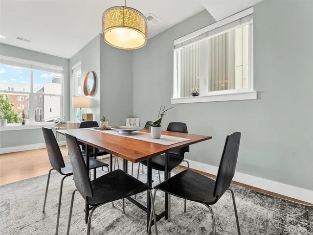 a dining room with furniture and window
