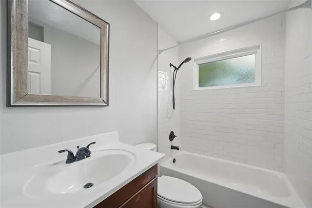 a bathroom with a toilet sink and bathtub