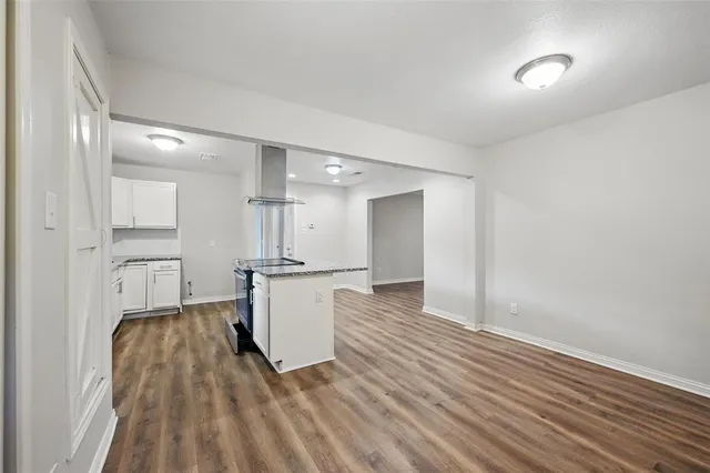 a view of kitchen with wooden floor