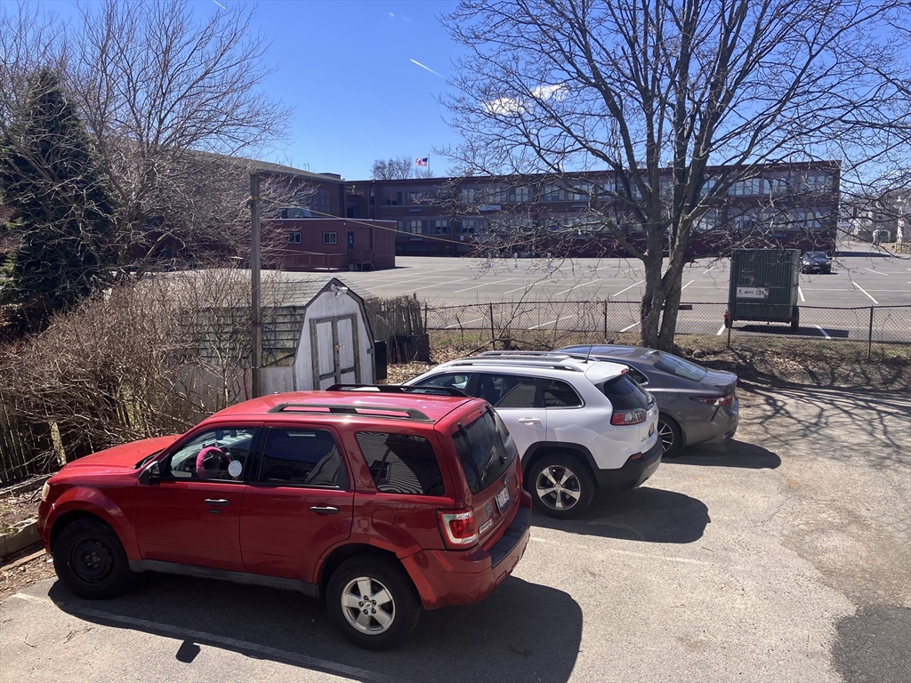 4 Sisson Terrace, Unit 1 Lynn, MA 01902 - Photo 4 of 16 a car parked in front of a house