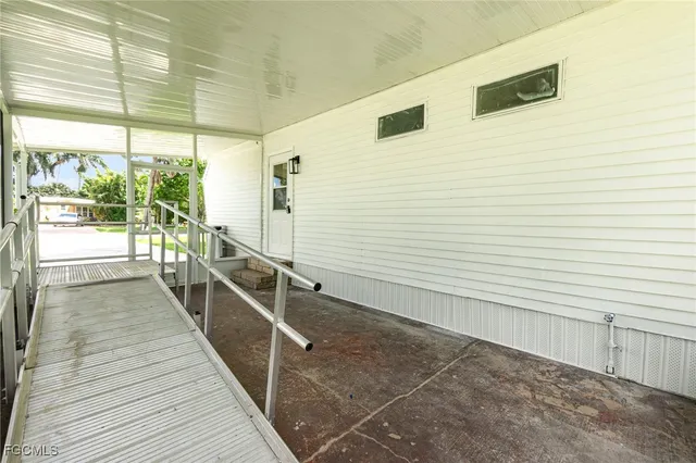a view of a balcony with wooden floor