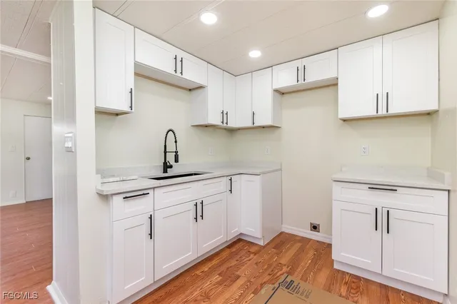 a kitchen with cabinets a sink and dishwasher