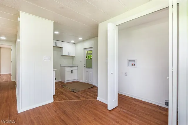 a view of a kitchen from the hallway