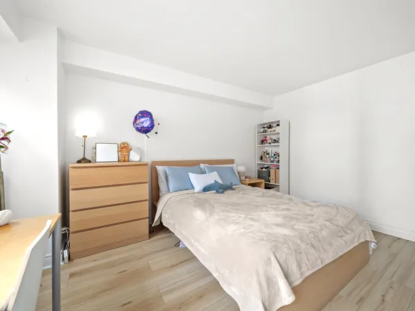 a bedroom with a bed and a cabinets