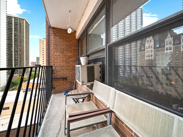 a view of a balcony with chairs