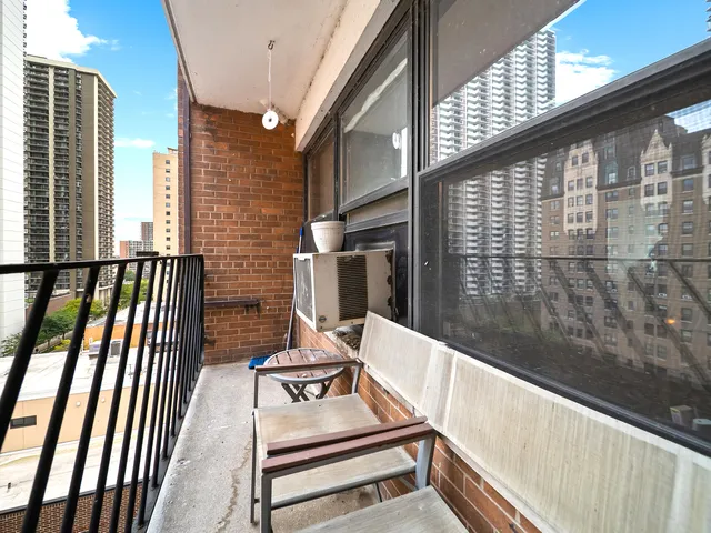 a view of a balcony with chairs