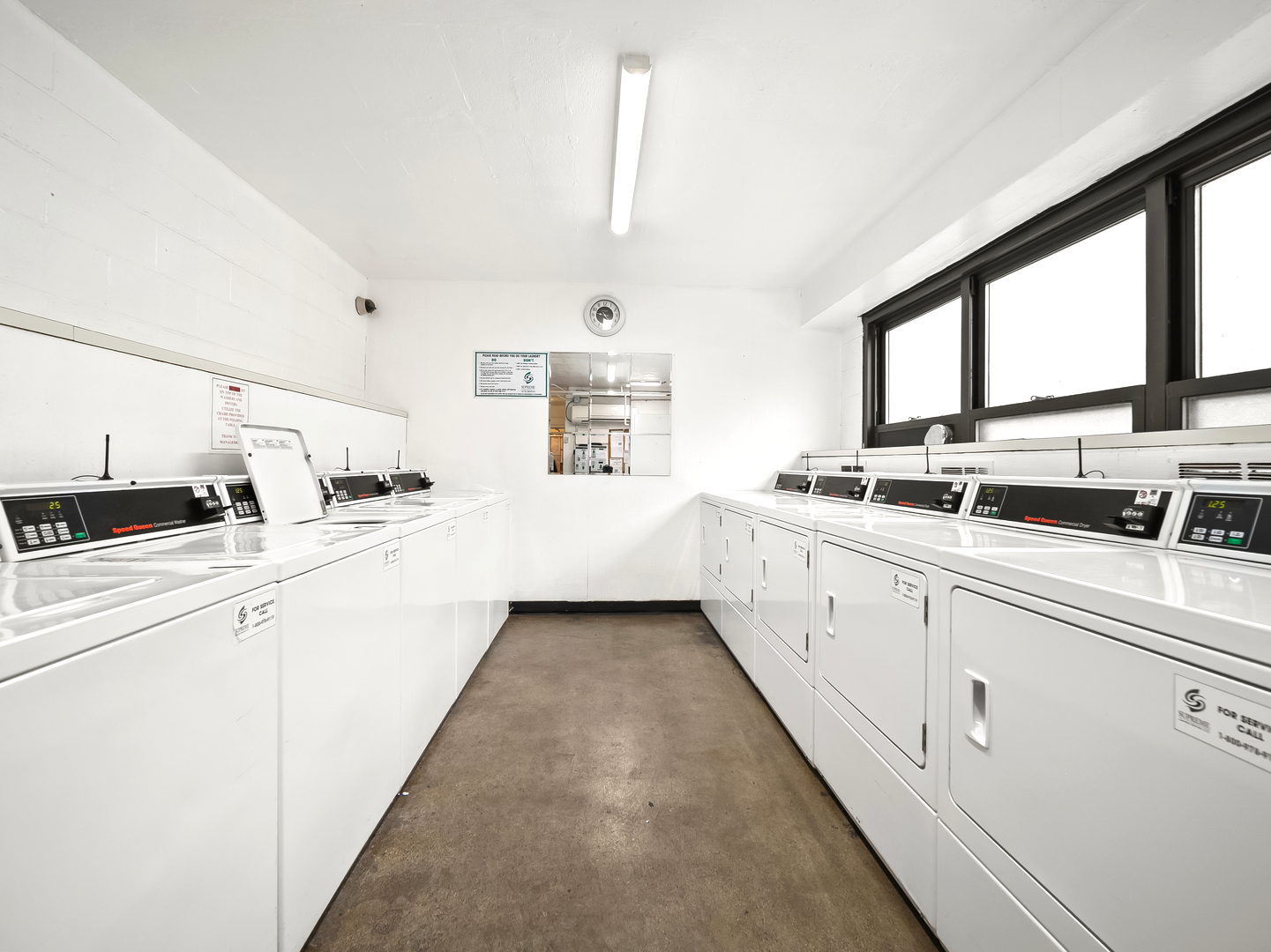 6118 North Sheridan Road, Unit 1008 Chicago, IL 60660 - Photo 19 of 19 a large white kitchen with sink and window