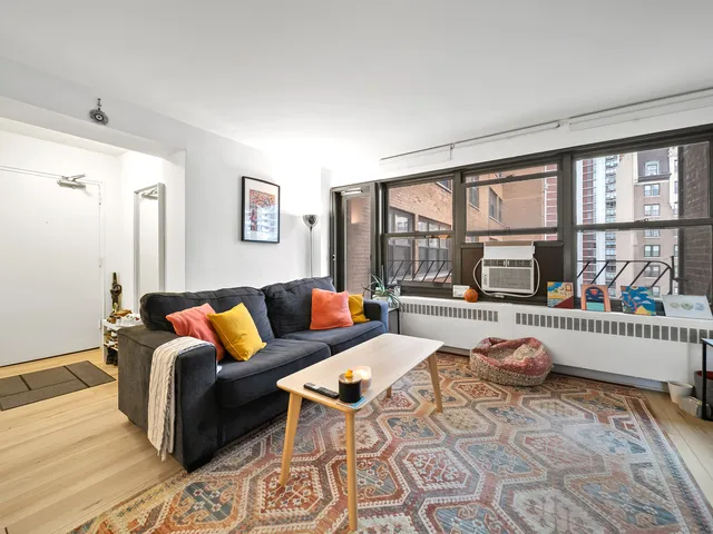 a living room with furniture and a table