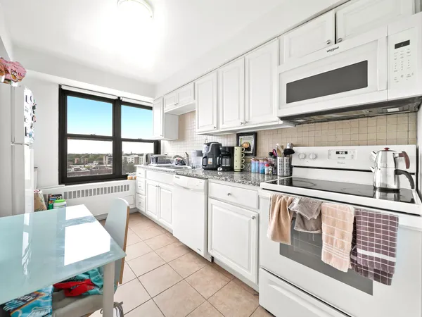 a kitchen with stainless steel appliances granite countertop a sink and cabinets